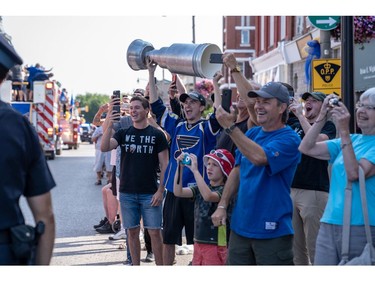 St. Louis Blues superfan Mark Metzger made a mock Stanley Cup to bring to the parade. (MAX MARTIN, The London Free Press)