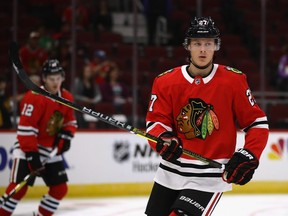 Adam Boqvist #27 of the Chicago Blackhawks participates in warm-ups before a preseason game against the Detroit Red Wings at the United Center on September 25, 2018 in Chicago, Illinois.  (Photo by Jonathan Daniel/Getty Images)