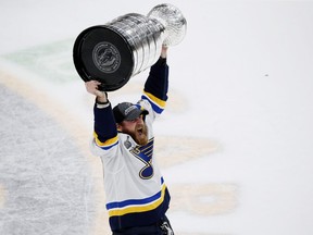 Ryan O'Reilly #90 of the St. Louis Blues hoists the cup after defeating the Boston Bruins 4-1 to win Game Seven of the 2019 NHL Stanley Cup Final at TD Garden on June 12, 2019 in Boston, Massachusetts. (Photo by Rich Gagnon/Getty Images)