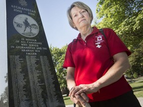 Theresa Charbonneau, mother of Cpl. Andrew Grenon, killed in Afghanistan in 2008, is pictured next to Windsor's Afghanistan memorial at Reaume Park, Friday, July 5, 2019.  Charbonneau will go to Ottawa to attend a rededication of memorial made by soldiers from black granite slabs relocated from the Canadian compound at Kandahar Airfield to Ottawa. (DAX MELMER/Windsor Star)