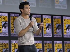 Canadian actor Simu Liu, a Western University alumnus, speaks on stage for the Marvel panel in Hall H of the Convention Center during Comic Con in San Diego, California on July 20, 2019. (Photo by Chris Delmas / AFP)