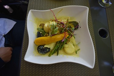 A lunch dish of fresh vegetables and mussels is enjoyed on the terrace of  le Mouton Noir in Baie-Saint-Paul. 
BARBARA TAYLOR The London Free Press