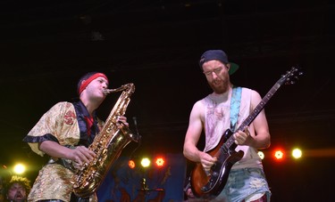 Five Alarm Funk's guitarist Gabe Boothroyd and Eli Bennett on sax give up the groove at Sunfest. (BARBARA TAYLOR, The London Free Press)
