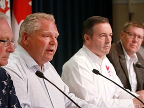 New Brunswick Premier Blaine Higgs, Ontario Premier Doug Ford, Alberta Premier Jason Kenney, Saskatchewan Premier Scott Moe and Northwest Territories Premier Bob McLeod (not pictured), speak to media after attending the Premier’s Stampede pancake breakfast at McDougall Centre in Calgary Monday, July 8, 2019.