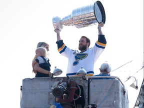 St. Louis Blues star Ryan O'Reilly holds the Stanley Cup over his head as he's carried through his hometown, Seaforth, during a parade Thursday morning. Photo taken July 25, 2019. (Max Martin/The London Free Press)