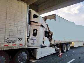 A tractor trailer collided with the rear-end of another truck on Highway 401 near Dutton sending two people to hospital with life-threatening injuries.