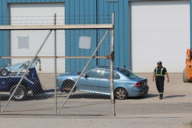 A car London police were examining after reports of a shooting near London's Oakridge neighbourhood was towed to Ross' towing yard. Photo taken Friday July 26, 2019. (Dale Carruthers/The London Free Press)