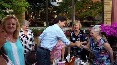 Prime Minister Justin Trudeau greets people at the Old South Village Pub in Wortley Village. (Dan Brown, The London Free Press)