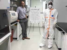 Researchers Stephen Barr, left, and Emma Ndashimye show off the new level three containment lab where researchers will study viruses including Zika and West Nile at Western University. Photo taken Monday July 29, 2019. Jennifer Bieman/The London Free Press