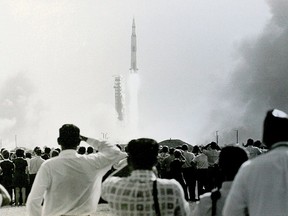 Thousands of people watch the launch of the Apollo 11 spacecraft on July 16, 1969, the which put the first man on the moon.