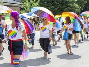 People march in the London Pride Parade in July 2019. The festival for London's LGBTQ community plans to hold a parade this year -- its first since 2019 -- and is moving to Dundas Place from Victoria Park. (Derek Ruttan/The London Free Press)