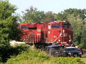 A CP rail freight train collided with a car on George Street in Innerkip, Sunday June 30,, 2019. The male driver of the car was pronounced dead at the scene and the male passenger died in hospital. The train crossing was marked by crossbucks, with no lights or barriers. (Sebastian Bron /The London Free Press)