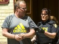 Ex-cop John Paul Stone, 57, of Listowel, is led out of court in Stratford after being sentenced to 18 months in jail Wednesday for possessing child pornography and internet luring. (Mike Hensen/The London Free Press)