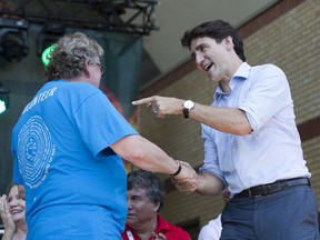 London Mayor Ed Holder welcomes Prime Minister Justin Trudeau to London as Trudeau makes a special appearance at the opening ceremonies of Sunfest at Victoria Park in London, Ont. on Thursday July 4, 2019. (Derek Ruttan/The London Free Press)