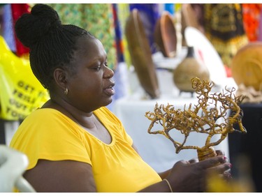 Peres Ochola of Mississauga, who came to Canada from Kenya, has a booth at Sunfest in Victoria Park loaded with Kenyan art. (Mike Hensen/The London Free Press)