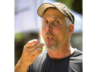 Craig Nutley of Arva gets rid of the evidence as he scarfs down a gyro at Sunfest in Victoria Park on Friday. (Mike Hensen/The London Free Press)
