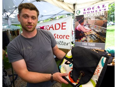 Samuel Ansell of Casa Relief talks about the jobs his organization is providing women in Nicaragua, Equador and Nepal at his booth at Sunfest in Victoria Park on Friday. (Mike Hensen/The London Free Press)