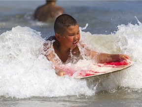 Landon Laskowski, 10 of Cambridge was practicing his boogie boarding with friends during a family road trip to Port Stanley's little beach  on Sunday July 7, 2019.  (Mike Hensen/The London Free Press)