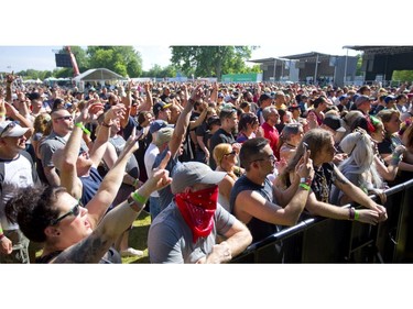 A large crowd in Harris Park reacts to opening act Pop Evil at Start.ca's Rock the Park in London on Thursday, July 11, 2019.  Mike Hensen/The London Free Press