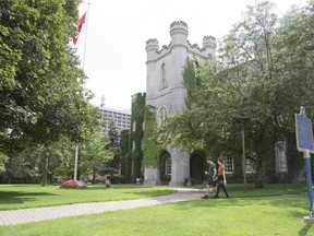 Andrew Cadotte and Samantha Mae walk past the old court house in London. (Derek Ruttan/The London Free Press)