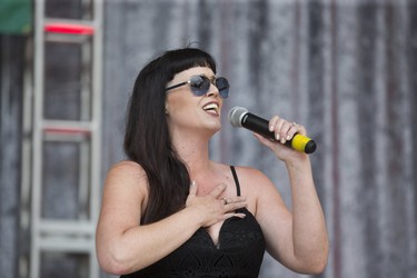 London's Leanne Mayer performs the national anthem during the opening ceremonies of the 46th Home County Music and Art Festival at Victoria Park. (Derek Ruttan/The London Free Press)