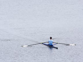 A rower skims across the surface of Fanshawe Lake in London, Ont. on Sunday July 21, 2019. Derek Ruttan/The London Free Press/Postmedia Network