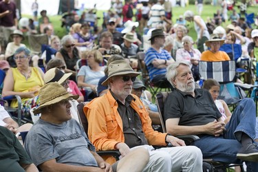 People enjoy a variety of artists playing folk and country music on the East Stage at the Home County Music and Art Festival in London, Ont. Derek Ruttan/The London Free Press/Postmedia Network