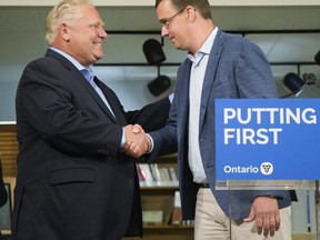 Premier Doug Ford shakes the hand of Lambton-Kent-Middlesex MPP Monte McNaughton at the Lucan Area Heritage and Donnelly Museum where he announced that the Ontario government is investing more than $300 million to improve Internet access and cellphone connectivity in rural communities. Derek Ruttan/The London Free Press