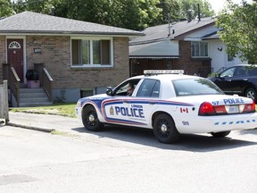 Police leave 1699 Hansuld Street in London, Ont. on Wednesday. A man died there Tuesday night. Derek Ruttan/The London Free Press