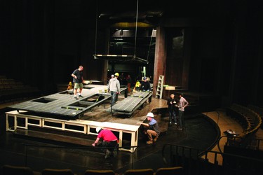 Members of the backstage crew transform the Festival stage from one production to another.