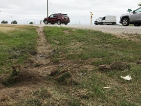 Muddy tire tracks still visible on Friday show the path of a vehicle in a  fatal crash on Thursday near Stratford. (Terry Bridge/Stratford Beacon Herald)