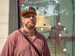 Hamilton Road area resident Ian Maclean says smashed windows at the Crouch Library have remained unfixed for months. And the branch isn't the only place having problem with broken windows in the area, he said. (Max Martin/London Free Press)