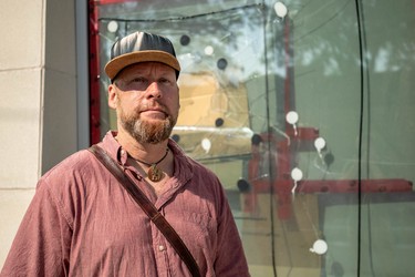 Hamilton Road area resident Ian Maclean says smashed windows at the Crouch Library have remained unfixed for months. And the branch isn't the only place having problem with broken windows in the area, he said. (Max Martin/London Free Press)