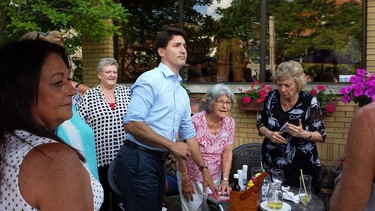 Prime Minister Justin Trudeau visits with people at the Old South Village Pub in Wortley Village. (Dan Brown, The London Free Press)