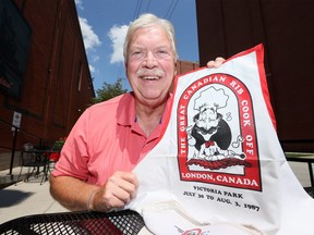 Rib Cook Off founder Doug Patterson with original apron and event manual from 1987.  (NICK BRANCACCIO/Windsor Star)