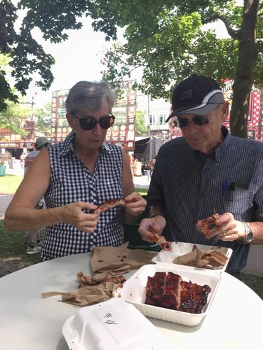 Melrose residents Mary Lou Dewan and Tom Nudds enjoy a rack of ribs at London Ribfest and Craft Beer Festival, which they have rarely missed since it began in the late 1980s. (JOE BELANGER, The London Free Press)