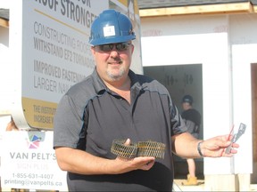 Doug Tarry of Doug Tarry Homes holds up the tools his company is using to make homes more resilient to high wind and tornados. The one year pilot project is in cooperation with Western University’s Institute for Catastrophic Loss Reduction.