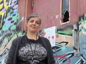 Tap Centre for Creativity executive director Sandra DeSalvo shows a back door that was recently broken as people tried to gain access to the downtown centre. (JONATHAN JUHA, The London Free Press)