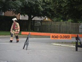 An early-morning gas leak in Tillsonburg, caused by a lightning strike, prompted fire officials to evacuate 60 homes as a precaution. No injuries were reported, and residents began returning home early Sunday, though much of the area remained closed and gas was shut off to 125 homes. Pictured, Tillsonburg deputy fire chief Ton Hietkamp walked in the Kara Lane neighbourhood shortly before 9 a.m. Sunday, as officials worked to pinpoint the gas leak. (Kathleen Saylors/Woodstock Sentinel-Review)