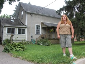 Donna Harris stands outside what was her old home on Walnut Street. The recent explosion in Old East Village brought back memories for Harris of the 1973 Oxford Park explosions and fires in which 10 homes were destroyed and dozens more damaged after a natural gas line was ruptured. (JONATHAN JUHA, The London Free Press)