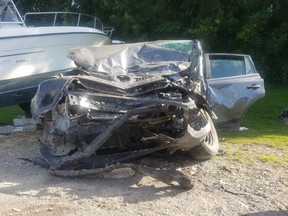 Five people were injured in a head-on crash Saturday afternoon on Highway 59 south of Woodstock between a car and a pickup hauling a boat, Oxford OPP said. (OPP Twitter)