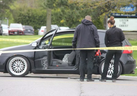 London police officers inspect a vehicle at the scene of a shooting at the corner of Trafalgar Street and Admiral Drive.	Photo taken May 11, 2019.

