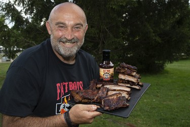 George Kefalidis, of Fat Boys Barbecue, is selling ribs at Rib Fest in Victoria Park in London. Derek Ruttan/The London Free Press