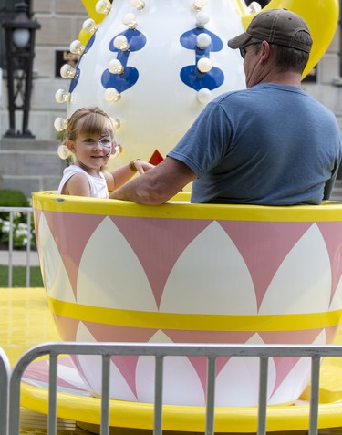 Dillan Erb, 4, enjoys the tea cups ride with her dad Terry Erb on the first day of Rib Fest in Victoria Park in London, Thursday Aug. 1, 2019. They were visiting from Clinton. Derek Ruttan/The London Free Press