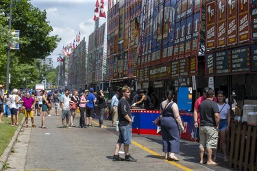 Hungry people line up to purchase lunch at The London Rib Fest and Craft Beer Festival in Victoria Park in London, Ont. on Monday August 5, 2019. Derek Ruttan/The London Free Press/Postmedia Network