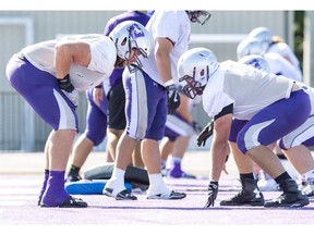 Dylan Giffen, left, lines up against fellow offensive lineman Michael Pacifico during practice at TD Stadium in London on Thursday. (Derek Ruttan/The London Free Press)