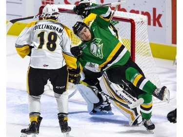 Sarnia Sting goalie Cameron Lamour gets away with a slew-foot on London Knight Billy Moskal during the first period of their pre-season game  in London, Ont. on Friday August 30, 2019. Derek Ruttan/The London Free Press/Postmedia Network