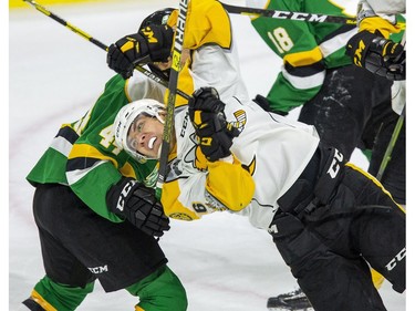 Sarnia Sting forward Theo Hill gets twisted by Jonathan Gruden off the London Knights during the first period of their pre-season game in London, Ont. on Friday August 30, 2019. Derek Ruttan/The London Free Press/Postmedia Network