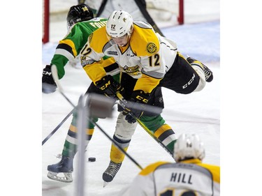The Sarnia Sting's Nolan DeGurse goes for a spin after colliding with Liam Foudy off the London Knights during the first period of their pre-season game in London, Ont. on Friday August 30, 2019. Derek Ruttan/The London Free Press/Postmedia Network