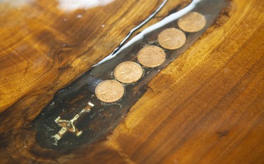 Pennies from the year each of the Martins was born are embedded in the live-edge table. (Mike Hensen/The London Free Press)